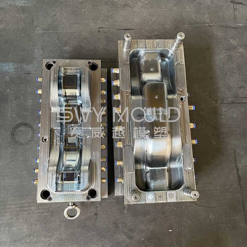 What are the components of an injection mold?